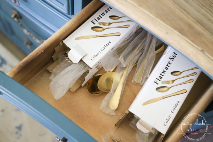 gold flatware in drawer