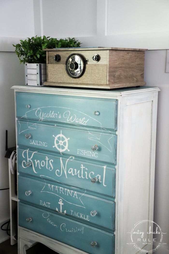 aqua chest with nautical graphic with record player on top