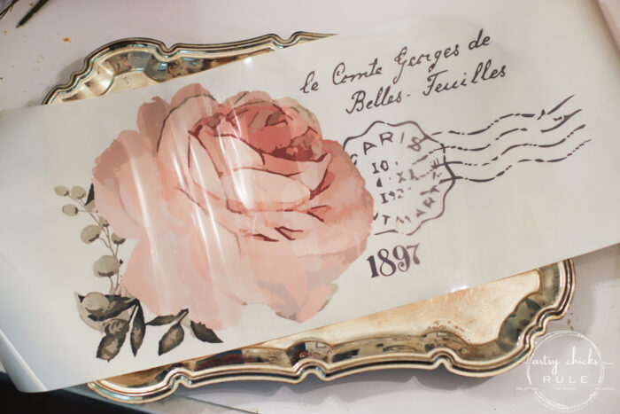 This pretty French rose decal was the perfect addition to this old metal thrift store tray! artsychicksrule.com #primatransfers #redesignwithprima #rosedecal #frenchstyle #frenchdecor #traymakeover