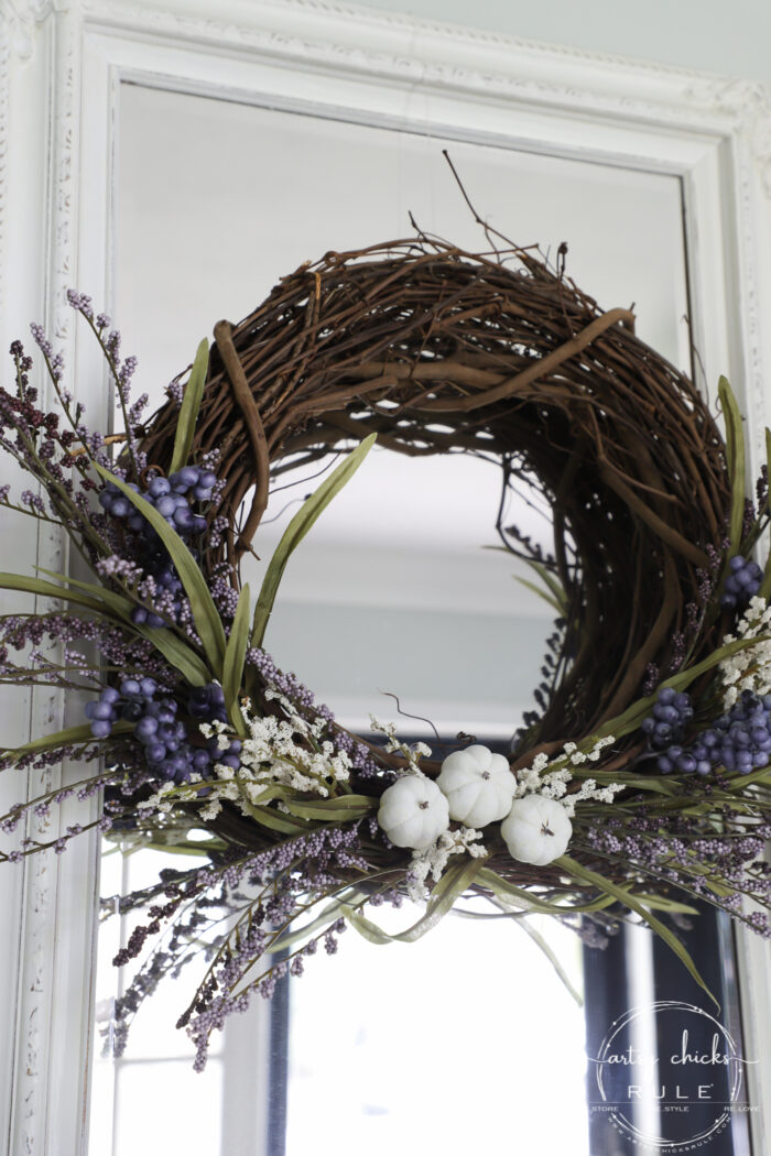brown wreath with purple and white floral and pumpkins