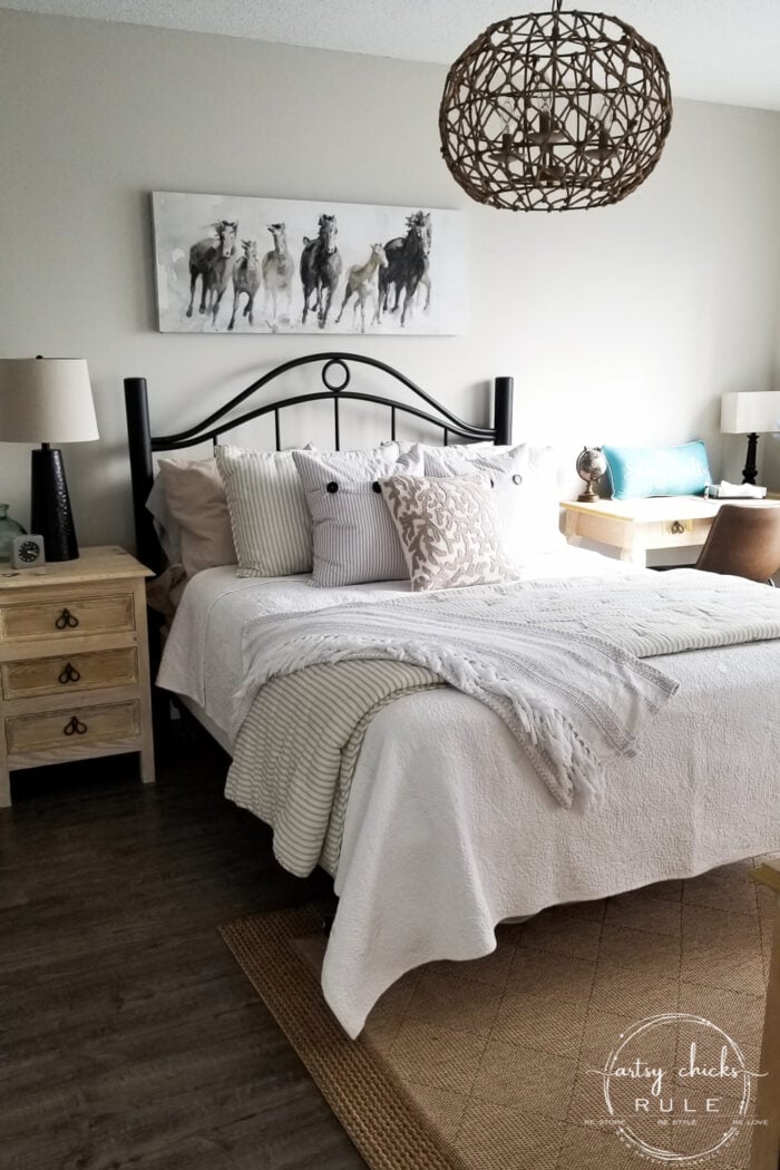 coastal bedroom with bed and nightstand