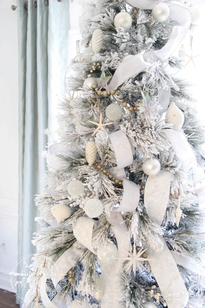 Have you ever wondered how certain trees just look magically covered in snow?? Well, and just magical?? Today I'm sharing 5 ways to up your tree game...with "snow" so you can have a magical snow covered Christmas tree look too! artsychicksrule.com #snowcoveredtree #snowytreelook #flockedtree #snowfilledtree