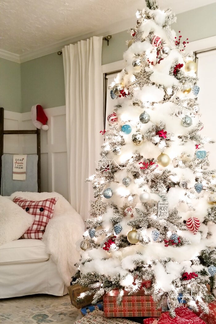 Have you ever wondered how certain trees just look magically covered in snow?? Well, and just magical?? Today I'm sharing 5 ways to up your tree game...with "snow" so you can have a magical snow covered Christmas tree look too! artsychicksrule.com #snowcoveredtree #snowytreelook #flockedtree #snowfilledtree