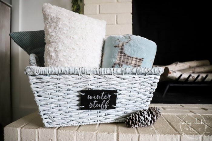 $4 thrift store basket becomes the perfect winter basket for storing winter goodies! Also great for a gift basket with winter essentials! Paint is all you need! artsychicksrule.com #winterbasket #basketmakeover #thriftstorebasket #winterstuff