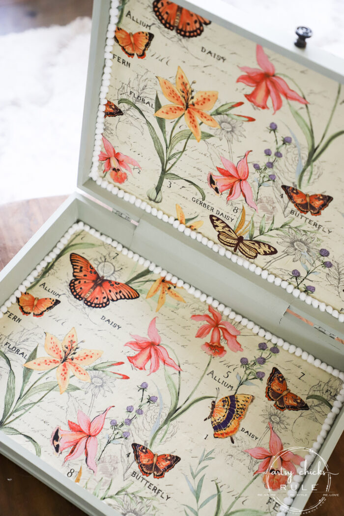 This old flatware box makeover uses pretty green paint, colorful new fabric and bird transfers for spring! Perfect for holding many things besides flatware! artsychicksrule.com #flatwarebox #silverwarebox #primadesigns #springprojects #fabricprojects