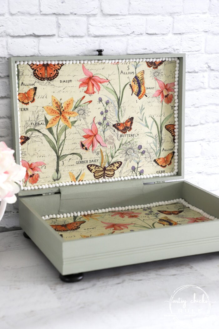 This old flatware box makeover uses pretty green paint, colorful new fabric and bird transfers for spring! Perfect for holding many things besides flatware! artsychicksrule.com #flatwarebox #silverwarebox #primadesigns #springprojects #fabricprojects