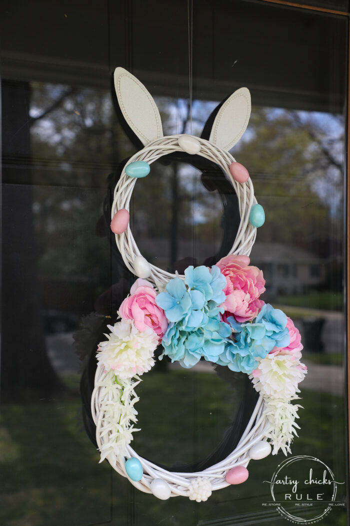 This adorable pink & blue bunny wreath is simple to throw together with just a few items! Perfect for spring and a fun project for kids! artsychicksrule.com #bunnywreath #pinkandbluewreath #springwreath #bunnyprojects