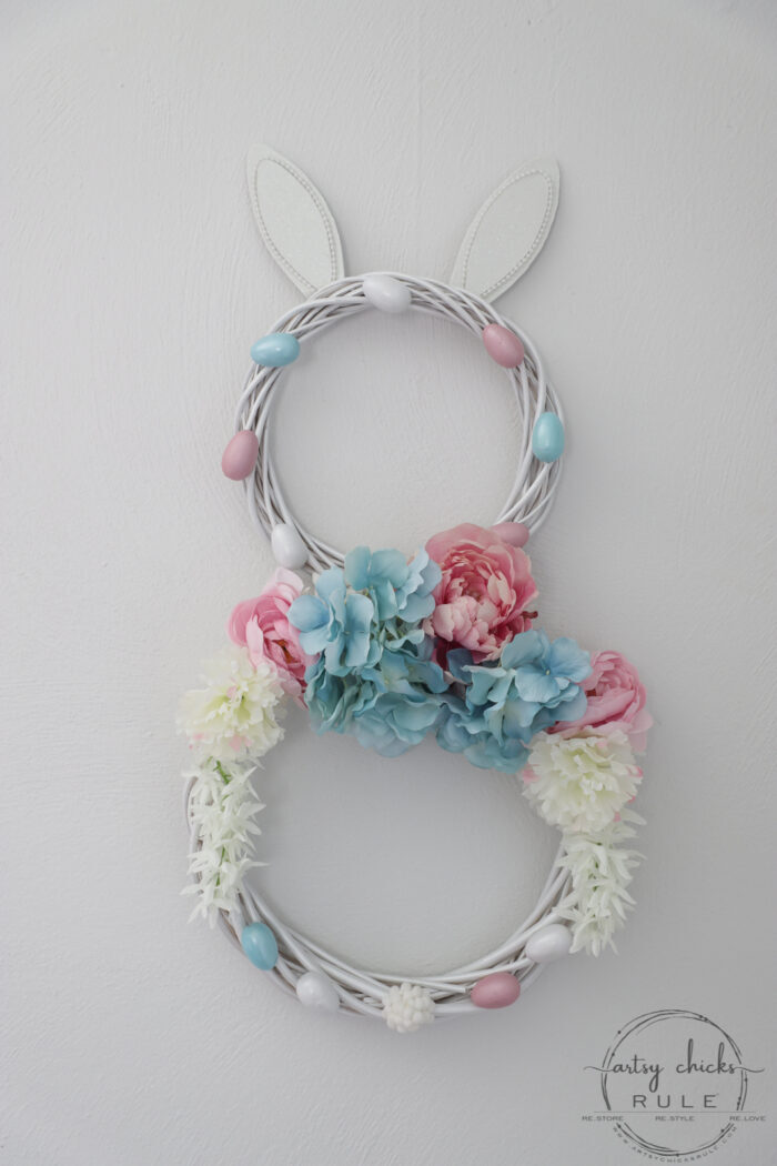 This adorable pink & blue bunny wreath is simple to throw together with just a few items! Perfect for spring and a fun project for kids! artsychicksrule.com #bunnywreath #pinkandbluewreath #springwreath #bunnyprojects