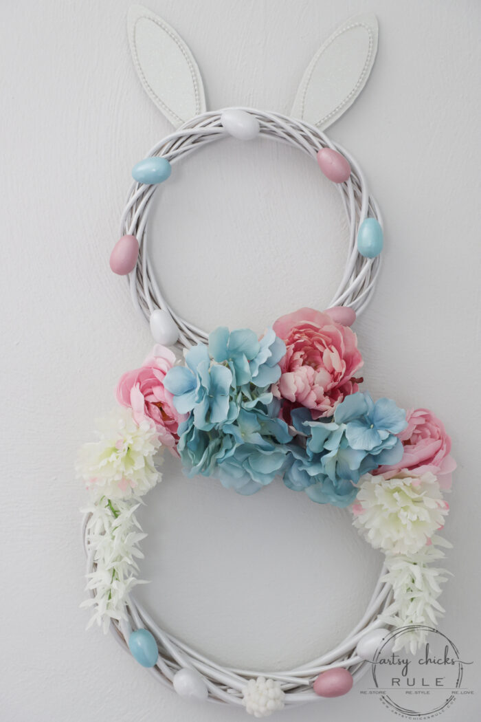 This adorable pink & blue bunny wreath is simple to throw together with just a few items! Perfect for spring and a fun project for kids! artsychicksrule.com #bunnywreath #pinkandbluewreath #springwreath #bunnyprojects