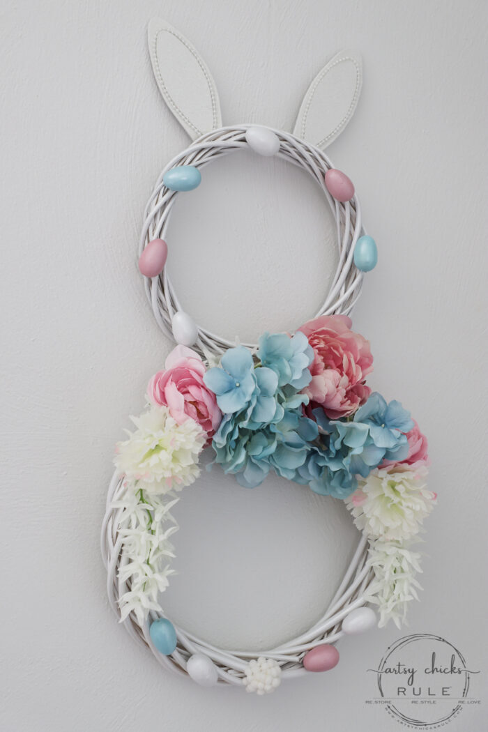 This adorable pink & blue bunny wreath is simple to throw together with just a few items! Perfect for spring and a fun project for kids! artsychicksrule.com #bunnywreath #pinkandbluewreath #springwreath #bunnyprojects