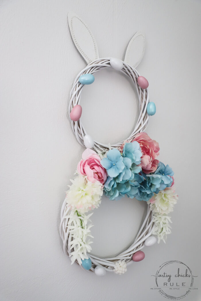 This adorable pink & blue bunny wreath is simple to throw together with just a few items! Perfect for spring and a fun project for kids! artsychicksrule.com #bunnywreath #pinkandbluewreath #springwreath #bunnyprojects