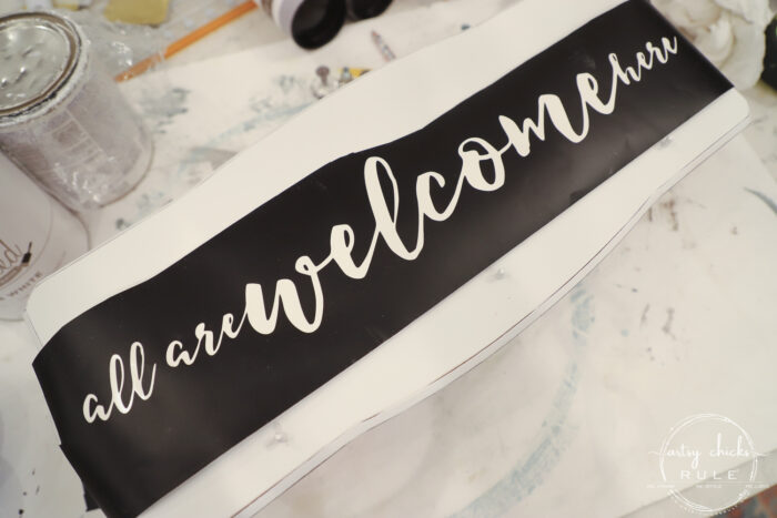 Create a welcoming sign with this "all are welcome here" free graphic I'm sharing! Plus see how I transformed this $3 thrift store find. artsychicksrule.com #freeprintable #allarewelcomehere #welcomesign #silhouettecameo