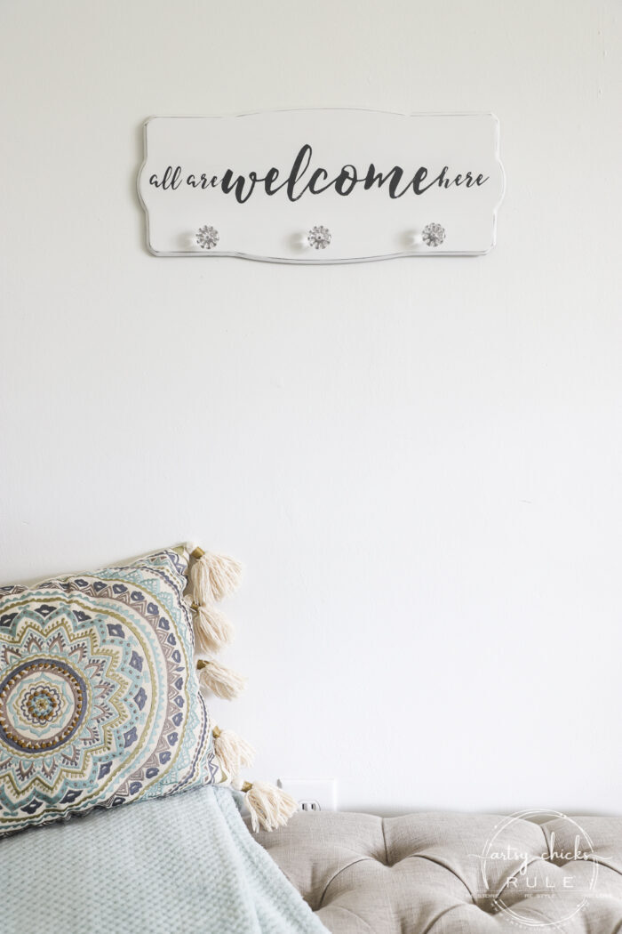 Create a welcoming sign with this "all are welcome here" free graphic I'm sharing! Plus see how I transformed this $3 thrift store find. artsychicksrule.com #freeprintable #allarewelcomehere #welcomesign #silhouettecameo