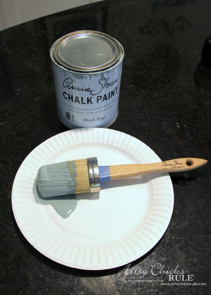 blue chalk paint can and brush with paint on it