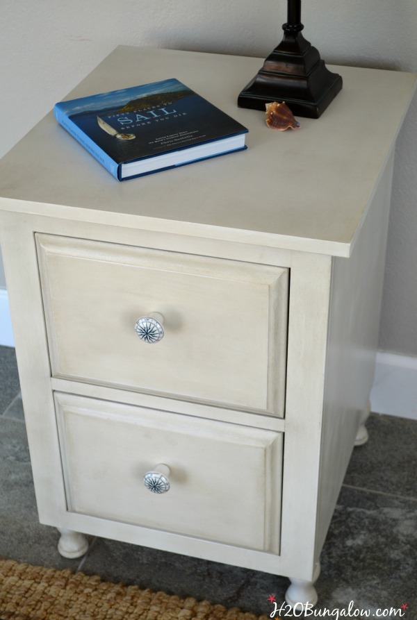 small night stand with book on top