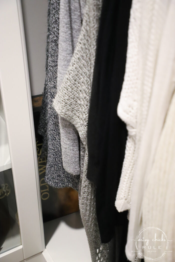 We created a "custom, built-in" master closet look with basic IKEA PAX closet system cabinets simply by adding trim and a few extra touches! artsychicksrule.com #builtincloset #ikeapax #paxclosethack #ikeapaxideas