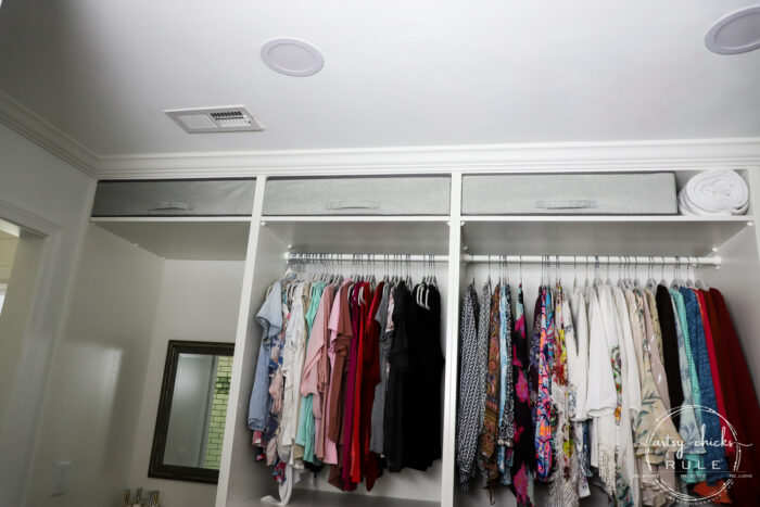 We created a "custom, built-in" master closet look with basic IKEA PAX closet system cabinets simply by adding trim and a few extra touches! artsychicksrule.com #builtincloset #ikeapax #paxclosethack #ikeapaxideas