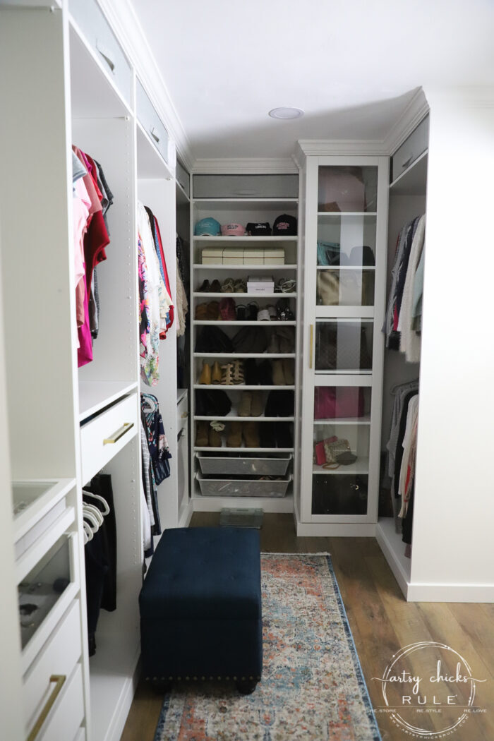 We created a "custom, built-in" master closet look with basic IKEA PAX closet system cabinets simply by adding trim and a few extra touches! artsychicksrule.com #builtincloset #ikeapax #paxclosethack #ikeapaxideas