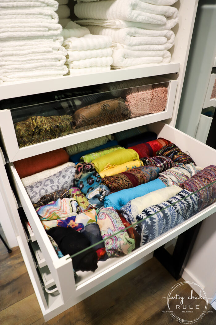 We created a "custom, built-in" master closet look with basic IKEA PAX closet system cabinets simply by adding trim and a few extra touches! artsychicksrule.com #builtincloset #ikeapax #paxclosethack #ikeapaxideas