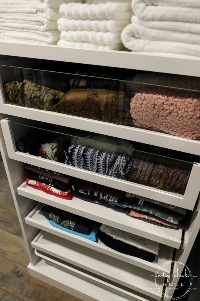 We created a "custom, built-in" master closet look with basic IKEA PAX closet system cabinets simply by adding trim and a few extra touches! artsychicksrule.com #builtincloset #ikeapax #paxclosethack #ikeapaxideas