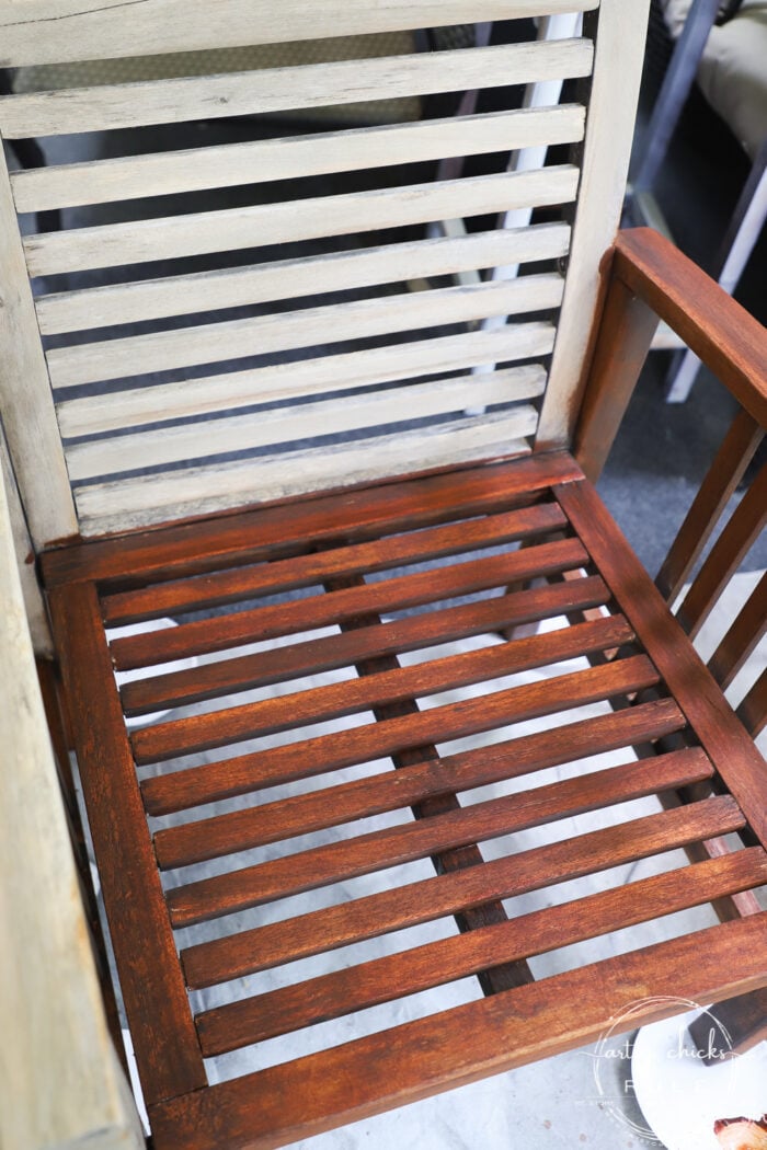 wood patio furniture half old and weathered, half stained