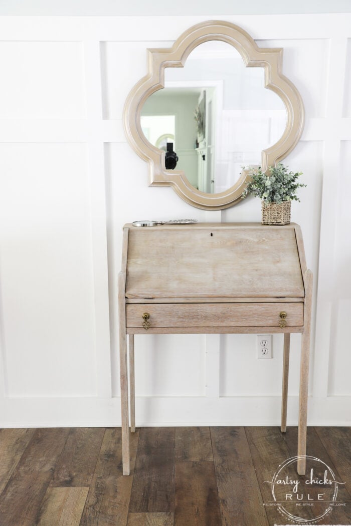 bleached small secretary desk with mirror over top