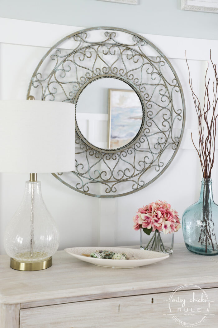 Sometimes all it needs is a little paint for a brand look and life. This simple metal mirror makeover is one anyone can do! artsychicksrule.com #metalmirror #scrollmirror