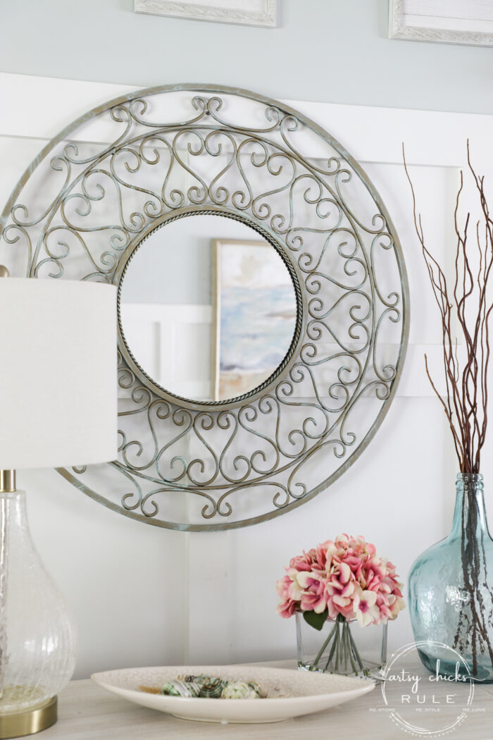 Sometimes all it needs is a little paint for a brand look and life. This simple metal mirror makeover is one anyone can do! artsychicksrule.com #metalmirror #scrollmirror