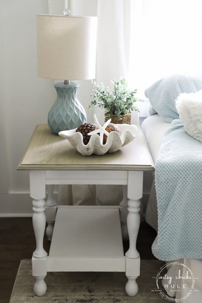 white and wood table beside couch