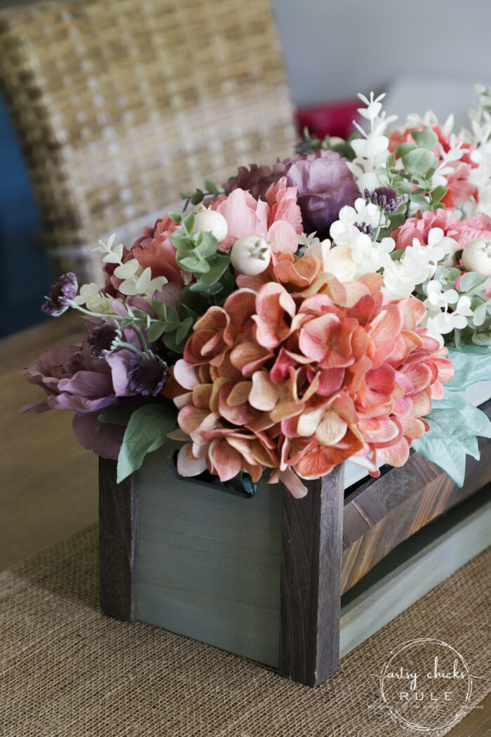 Using an old thrifty find, plus fall florals from the store, make this non tradtional fall floral centerpiece simply! artsychicksrule.com #fallfloralcenterpiece #fallflowers