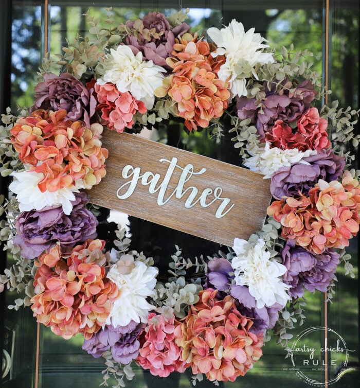 purple, rust and cream wreath with gather sign in the middle