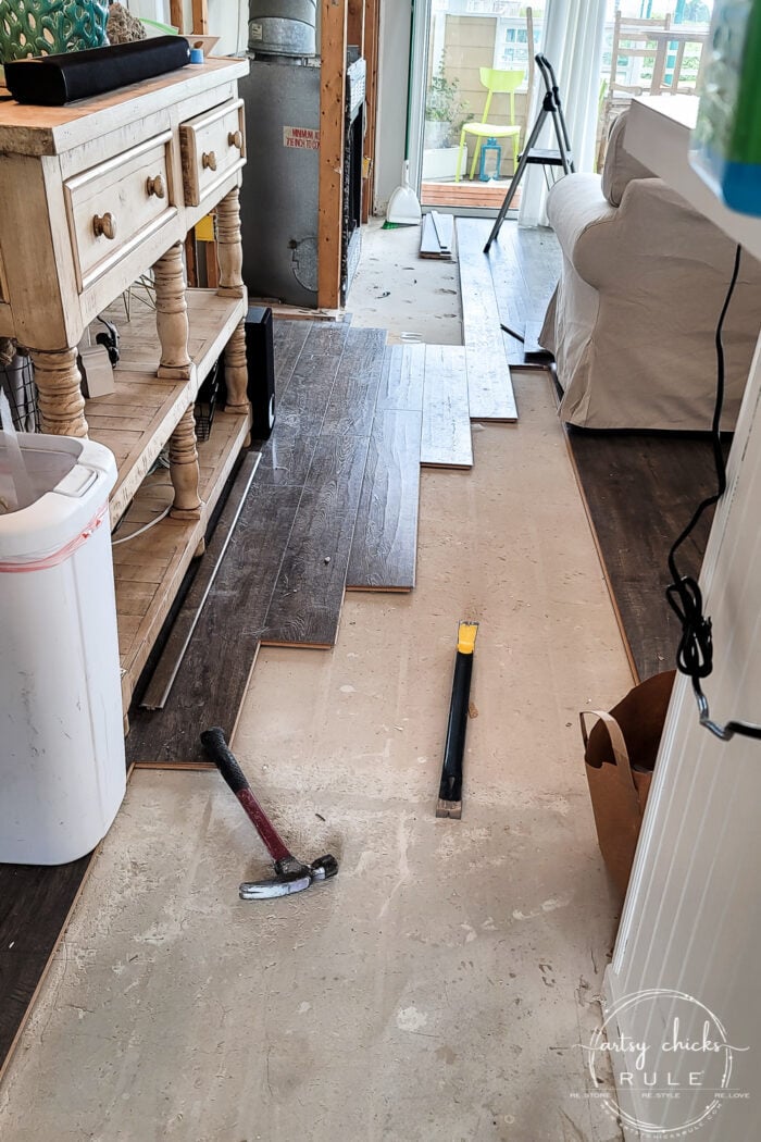 Today I'm talking about our waterproof hardwood flooring update, the importance of finding the right retailer, and how to prep for flooring install. artsychicksrule.com #flooringupdate #waterproofflooring