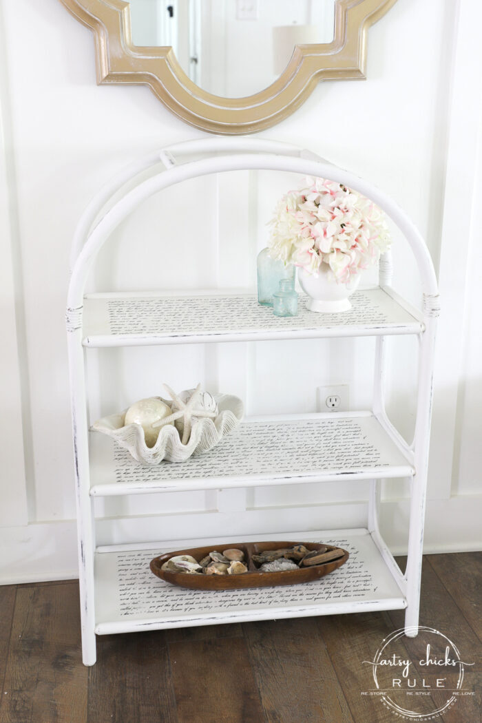 This thrifted arched shelf got a brand new look with paint (easy!) and pretty decorative transfers (so easy!). artsychicksrule.com