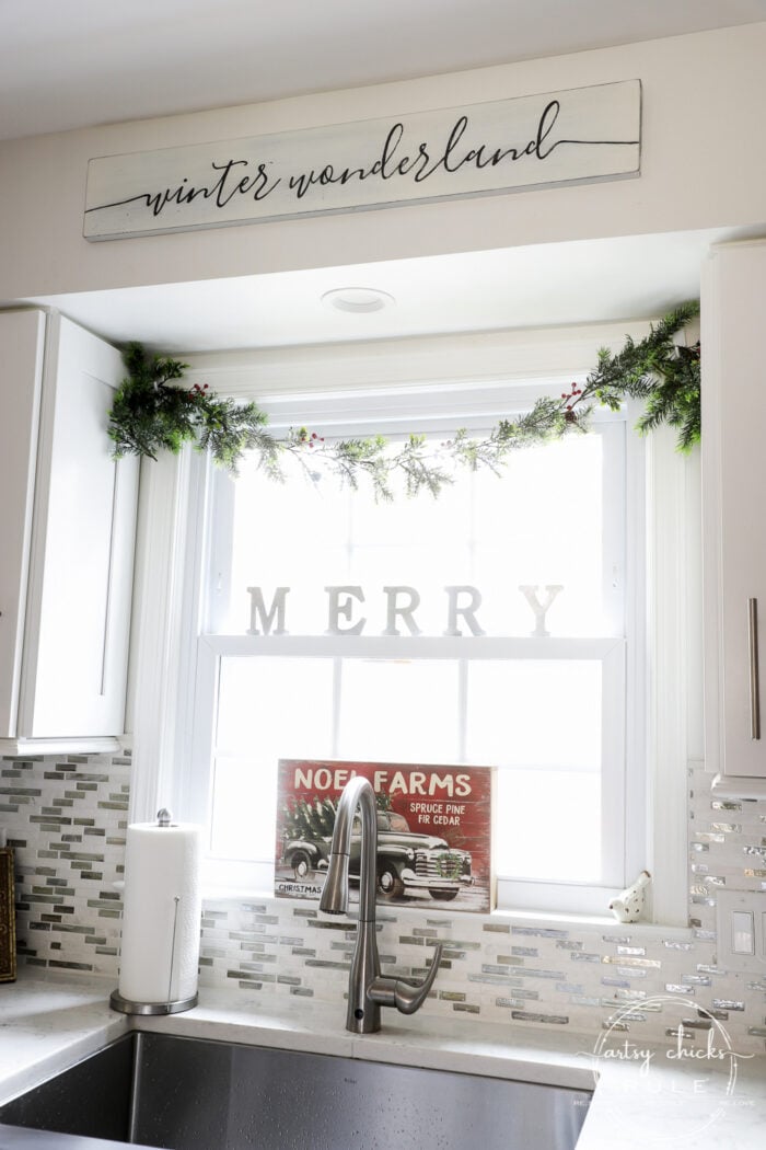 Creating a cozy Christmas kitchen (and home) with simple touches of red and treasured collections for a relaxed, homey feel. artsychicksrule.com