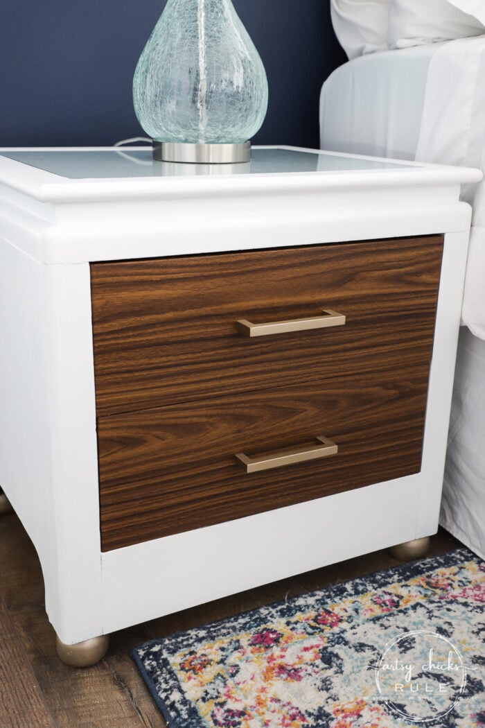 White nightstand with wood look vinyl drawer fronts