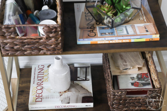 bookshelf with books and baskets