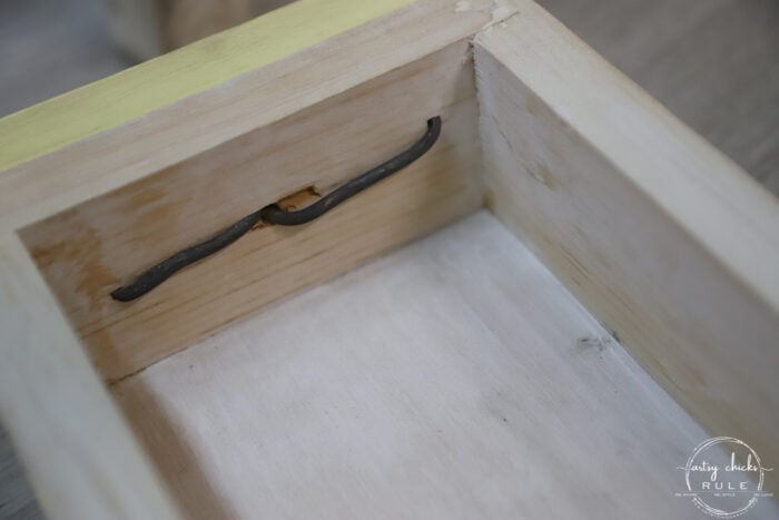 inside of drawer showing metal wrapped hardware