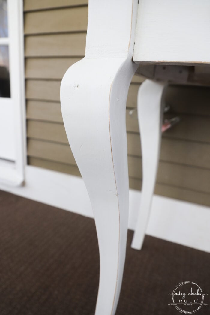 white painted distressed leg