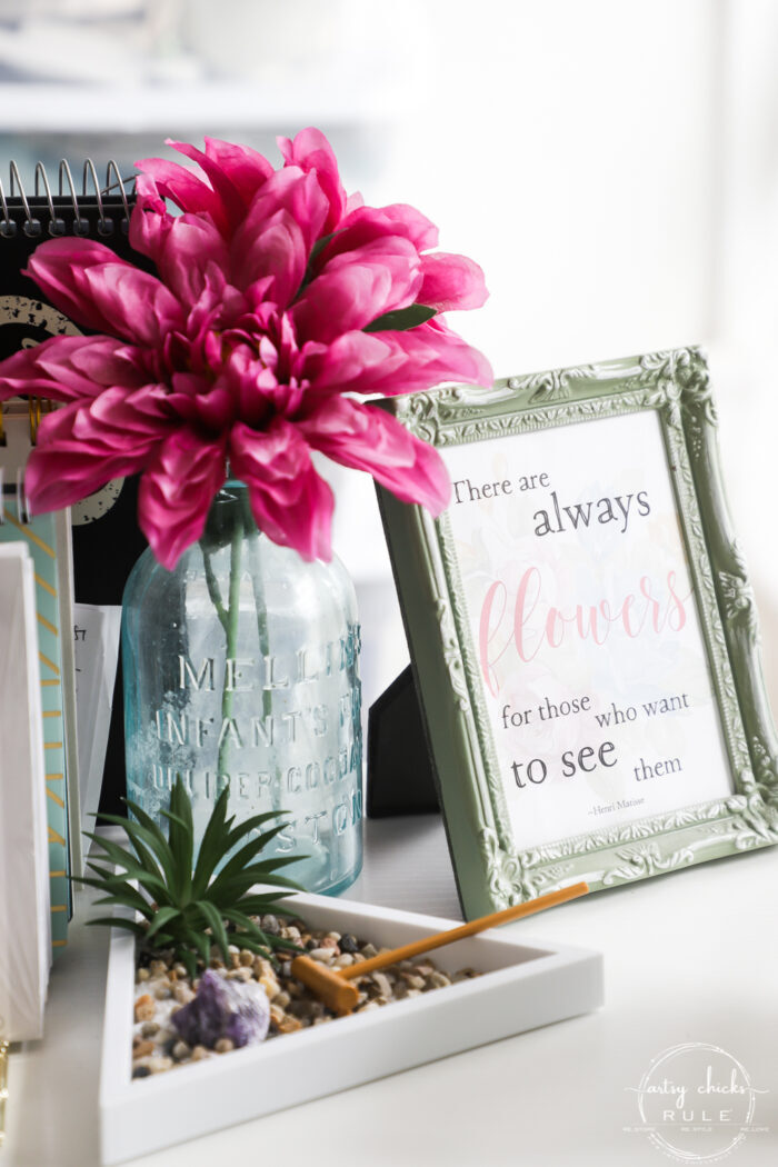 pink flower and spring sign