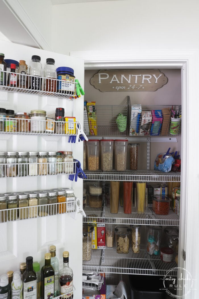 full view of pantry with door open and all shelving