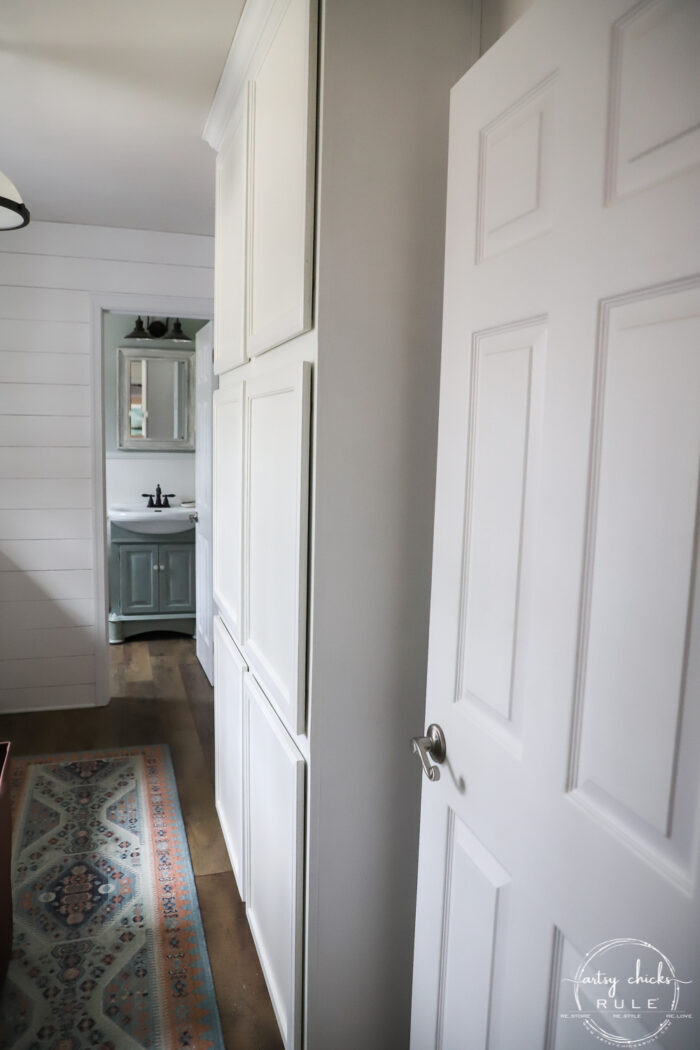 Laundry room with wall of cabinets for extra pantry space