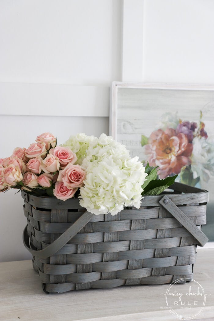 Sheer green stained basket filled with spring flowers