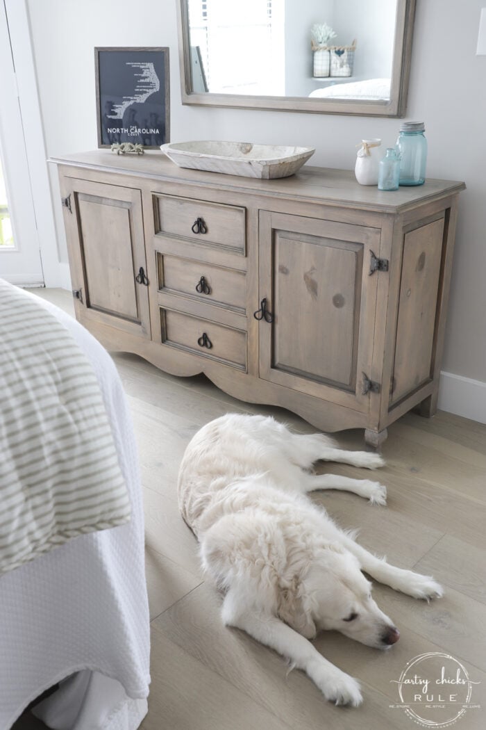 driftwood dresser stained with white dog sleeping