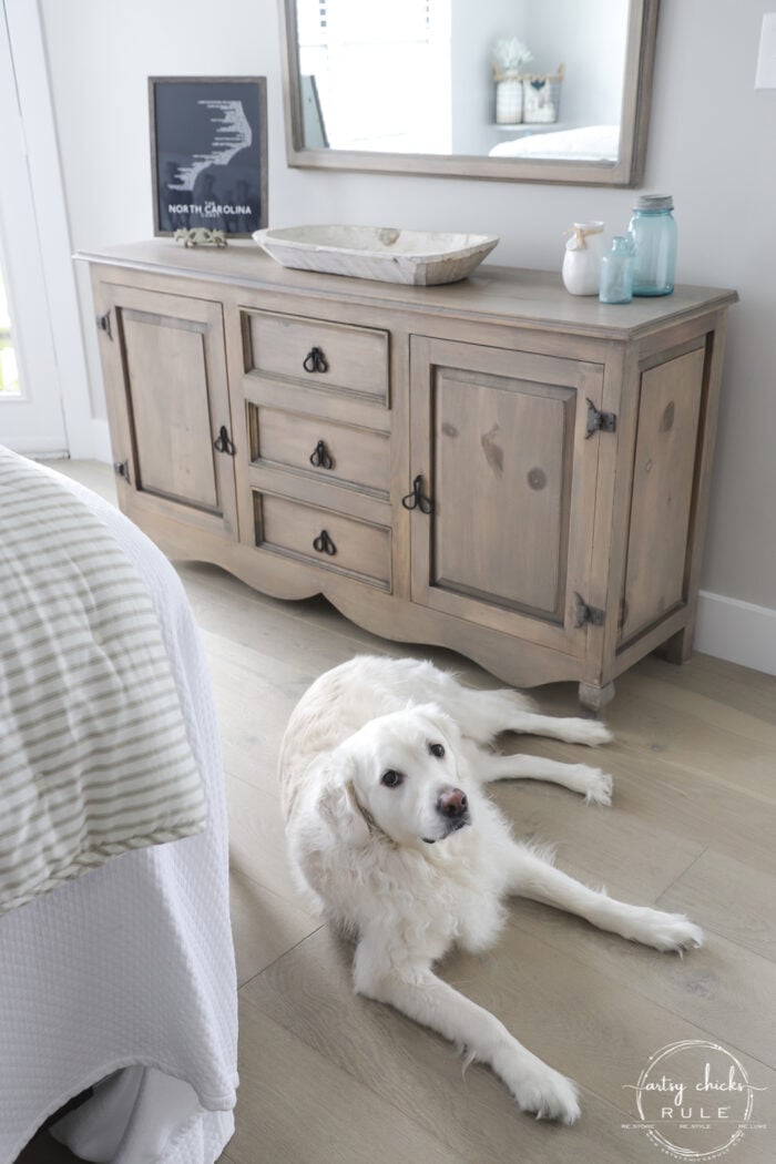 driftwood dresser with white dog