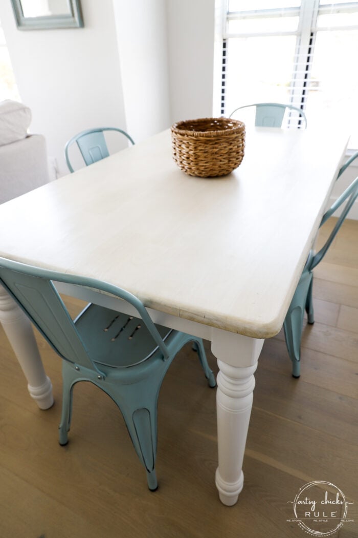 side view of table with blue chairs