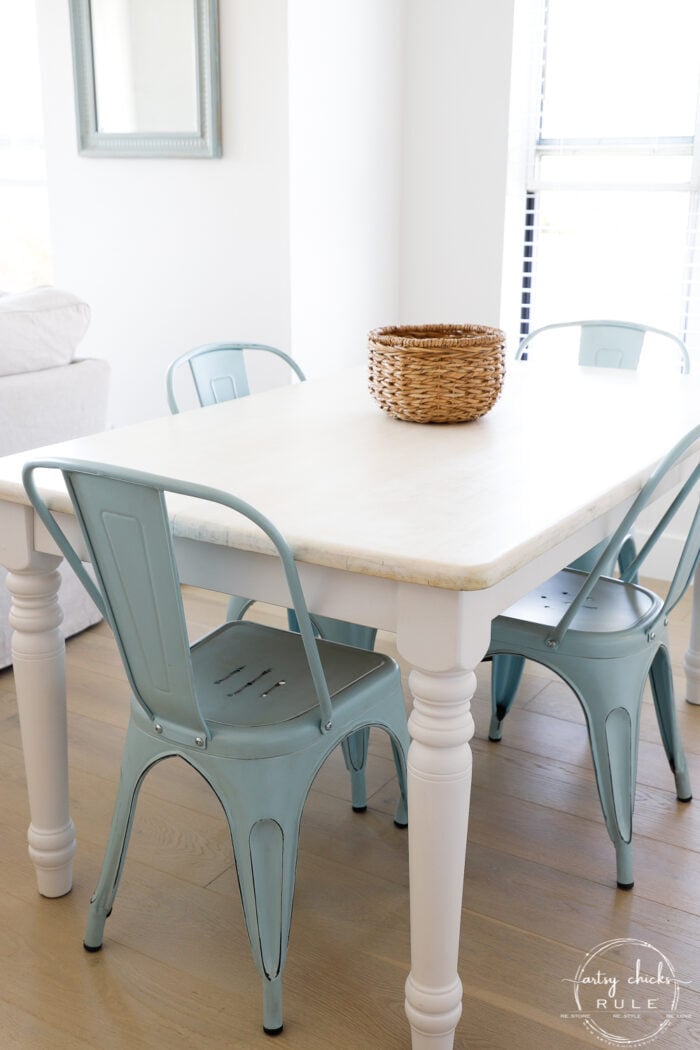 styled table view with basket on top and blue chairs