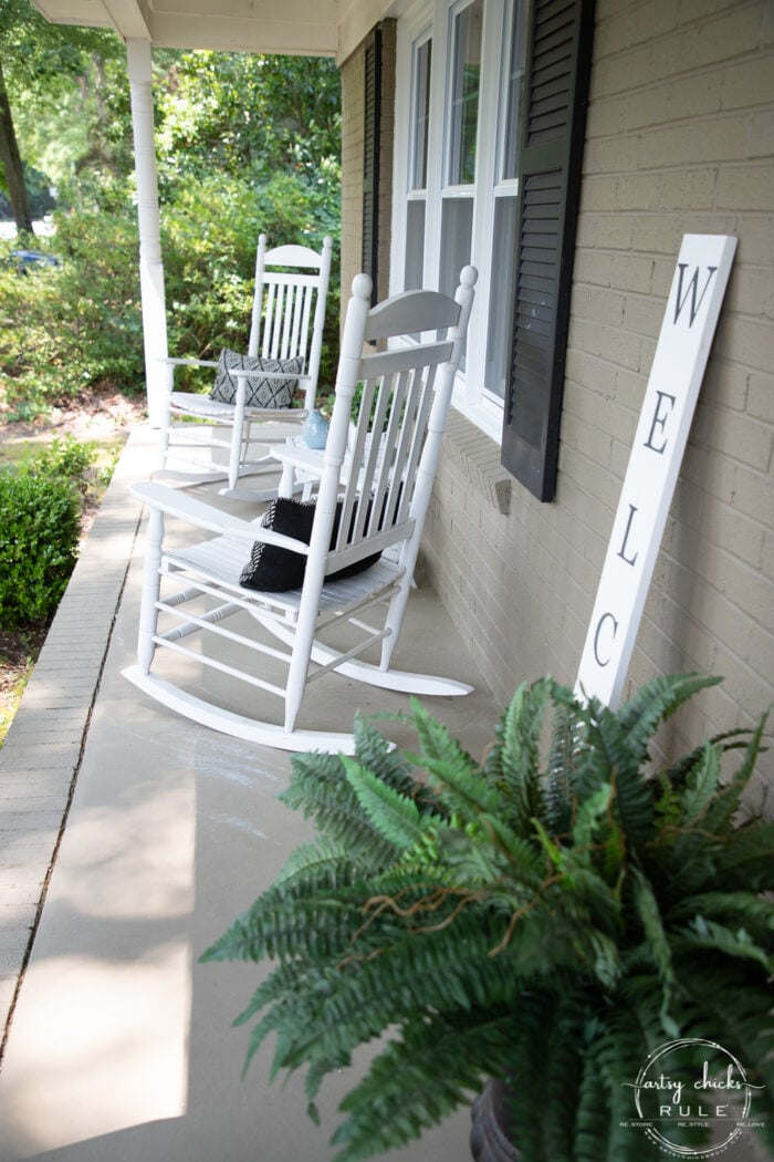 white rockers and green fern