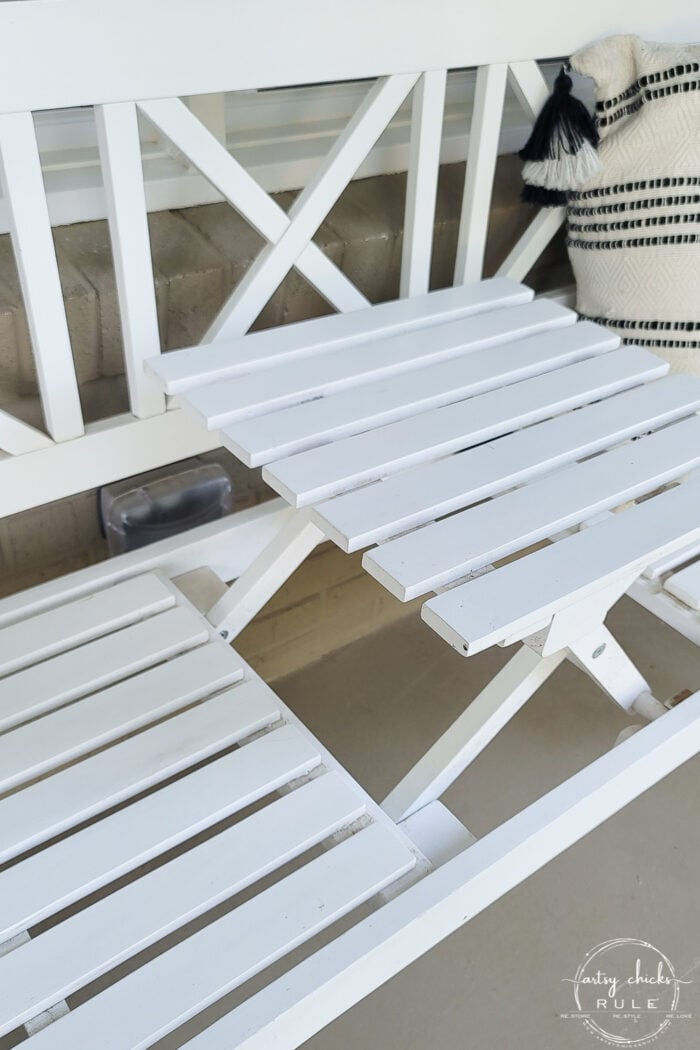 white bench with raised table in middle