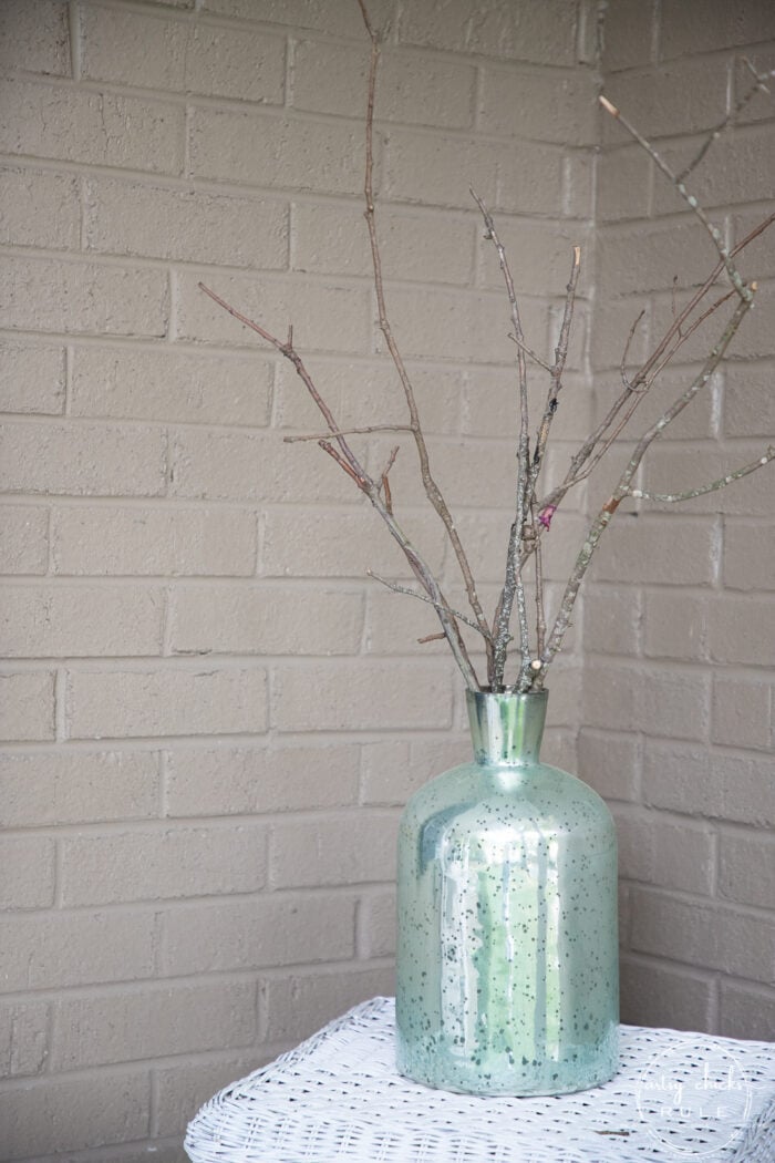 green vase with branches