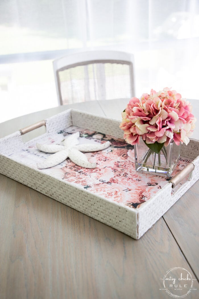 styled basket tray with pink flowers and starfish